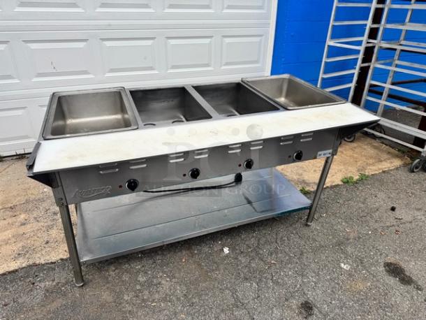 Avantco 4 Bay Steam Table, Model 177STE4SA, 120V, tested and working. Features stainless steel construction, four control knobs.