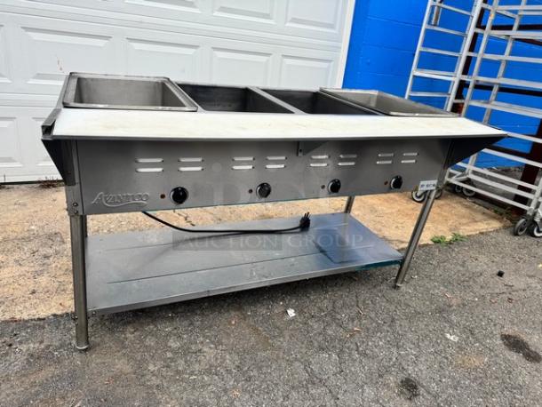 Avantco 4 Bay Steam Table, model 177STE4SA, 120V tested and working, stainless steel, with control knobs and lower shelf.