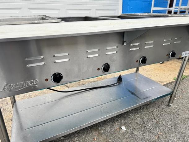 Avantco 4 bay steam table model 177STE4SA, stainless steel, 120V, tested and working, with adjustable knobs.