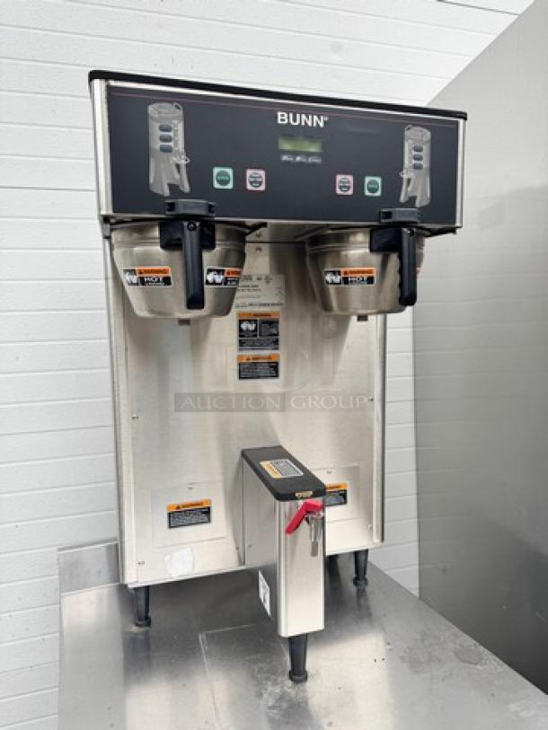 BUNN Dual Coffee Brewer 120/240V, model TF DBC, stainless steel. Features dual brewing stations, control panel, and visible brand markings.