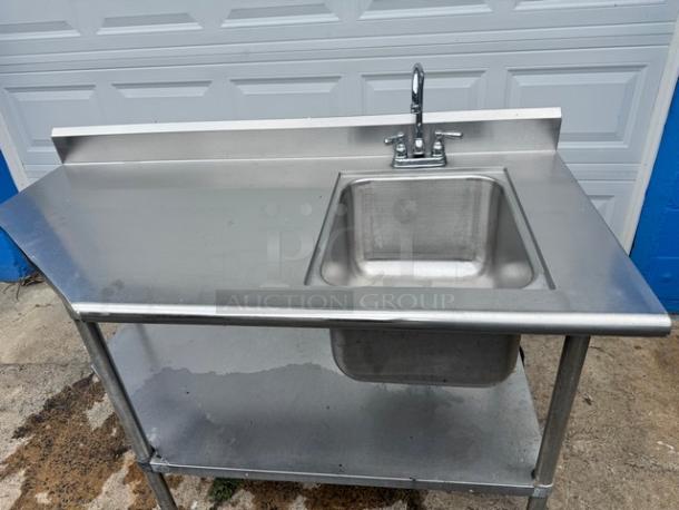 Stainless steel 60" sink and table with integrated basin, damaged faucet. Industrial-grade, used condition.