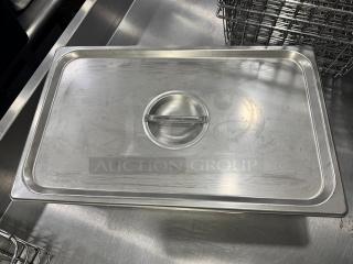 Stainless steel 21x13" full-size food pan with lid, light scratches, sturdy handle, suitable for professional kitchens.