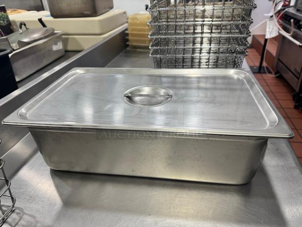 Stainless steel food pan with lid, 21x13 inches, full-size, used condition, fits standard commercial kitchen setups.