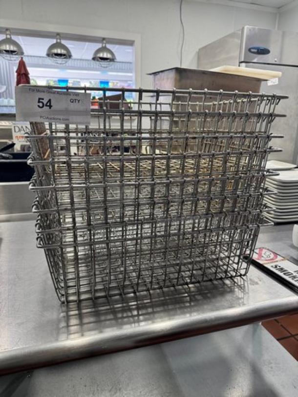 20x14" metal wire baskets, BIDX8, stacked on a table, used condition, item tag showing lot 54, quantity unspecified.