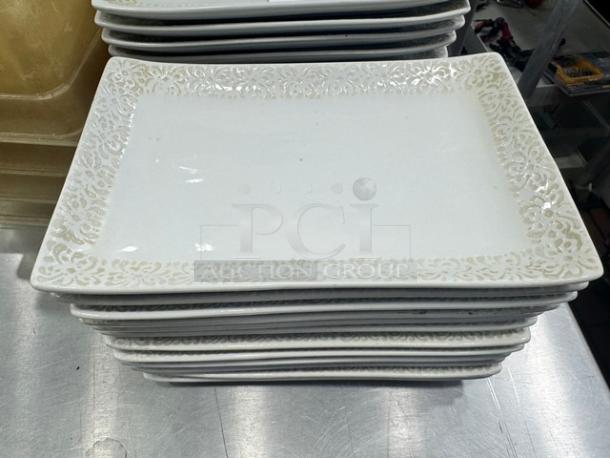 Rectangular porcelain plate BIDX14 with ornate edge design, pristine condition. Ideal for elegant dining settings.
