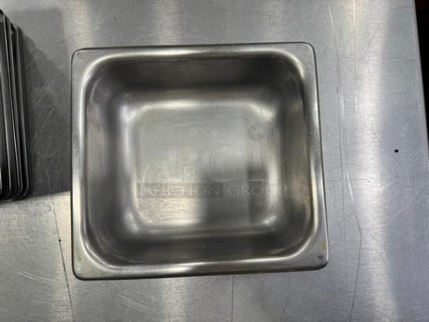 7" stainless steel food pan BIDX12, durable, lightly used, smooth interior, ideal for kitchen storage.