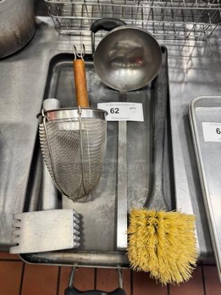 Miscellaneous kitchenware collection includes sieve, ladle, brush, and strainer, in used condition, all sold together.