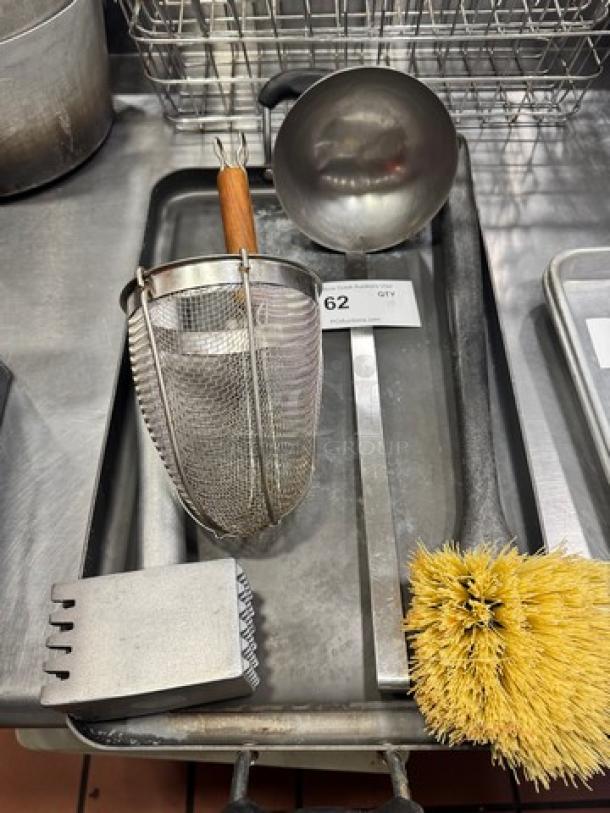 Miscellaneous kitchenware set includes metal skimmer, ladle, scrubber, and brush. All items in used condition. Auction lot 62.