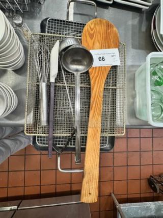 Assorted kitchenware including a wooden spoon, ladle, whisk, and knife, all in used condition, sold as one lot.