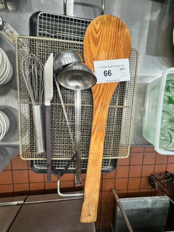 Miscellaneous kitchenware set, includes wooden spoon, whisk, ladle, knife; auction tag "66 QTY." Good condition.