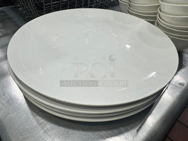 Round porcelain serving platter, 12 1/2" diameter, model BIDX4. Features a smooth, white finish; excellent condition.