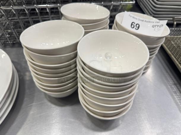 Set of 4" porcelain sauce bowls, model BIDX36, in excellent condition. Glossy white finish, stacked neatly. Quantity: 36.