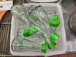 Lot of 11 clear glass soy sauce dispensers with green lids. In good condition, suitable for dining or kitchen use.