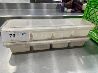 Lot of 2 plastic condiment holders with clear lids, six compartments each, used condition, auction label "73 QTY".