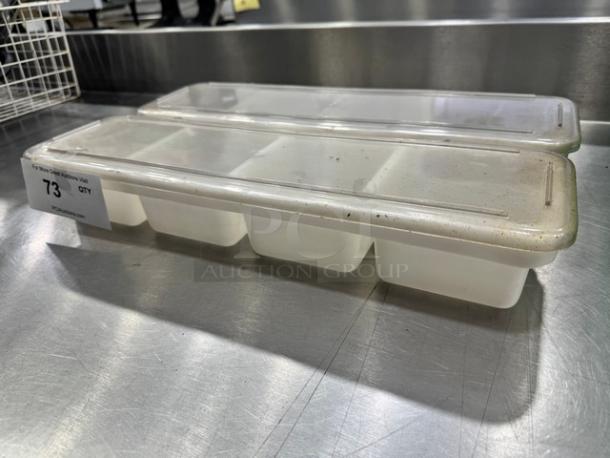 Lot of 2 plastic condiment holders with lids, used condition, slight surface wear, 6 compartments each, item tag indicates lot 73.
