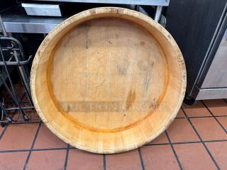 28x7" wood barrel bowl with a natural finish, visible grain patterns, and signs of wear, enhancing its rustic appeal.