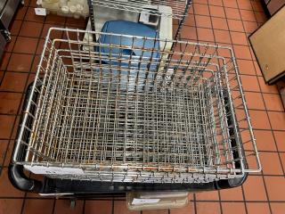 Metal wire basket with grid pattern, slight rust visible. Ideal for storage, measuring approximately 18x12x8 inches.