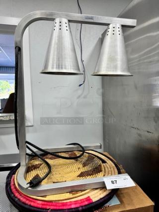 Commercial food heat lamp with dual silver conical shades on a metal frame. Includes power cord; item number 87.