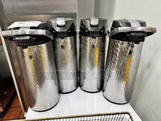 Four Newco Thermal Airpots BIDX4, stainless steel, with black lids and carrying handles, in excellent condition.