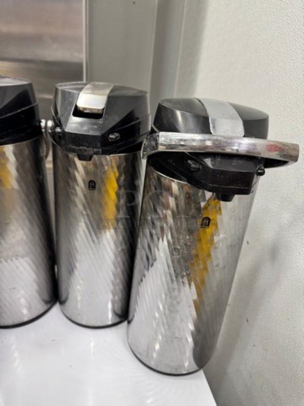 Newco Thermal Airpots BIDX4, stainless steel, textured finish, black lids, used condition.