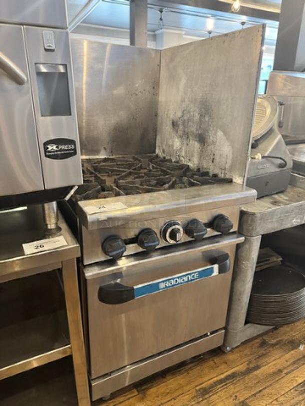 Radiance Natural Gas 4 Burner Stove+Oven on legs, stainless steel, used condition, control knobs, brand label visible.