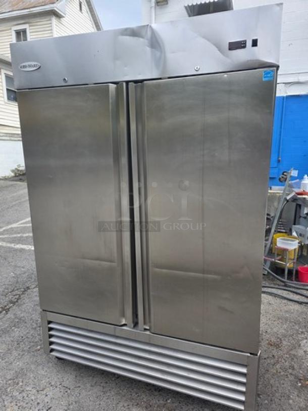 Serv-Ware RR2 2-Door Stainless Steel Commercial Refrigerator on casters, showing wear, with visible brand logo.