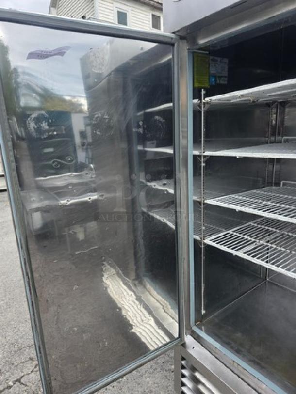 Serv-Ware RR2 Reach-In, 2 Door Commercial Stainless Steel Refrigerator on casters, open, showing shelves, used condition.