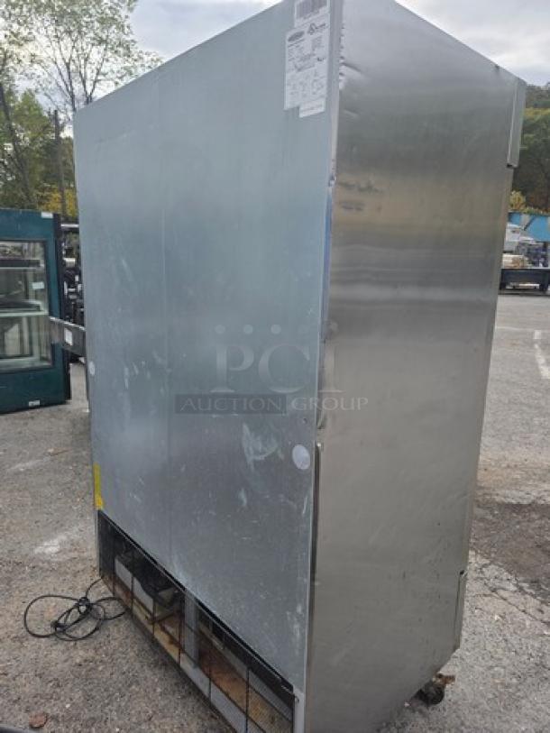 Serv-Ware RR2 reach-in, 2-door stainless steel refrigerator on casters, used condition, visible wear, model RR2 label on top.