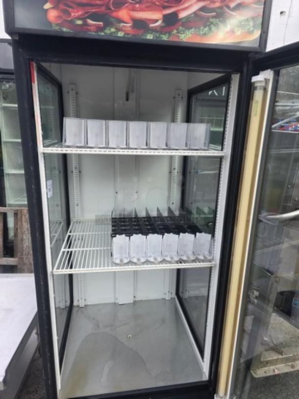 True GDM-26-LD glass door merchandiser, one door, white interior, shelves included, excellent condition, True brand label visible.