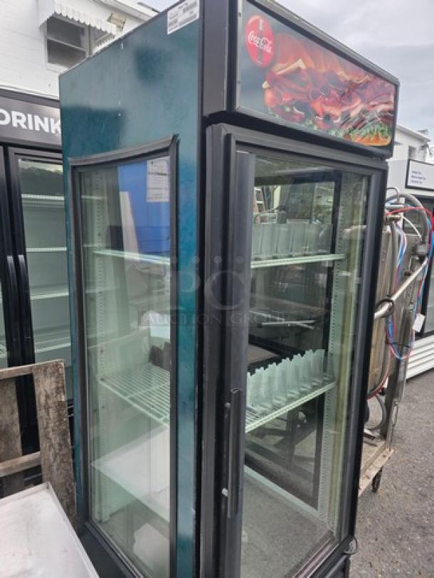 True GDM-26-LD Glass Door Merchandiser, single door, used condition, glass display, top Coca-Cola signage, multiple shelves.