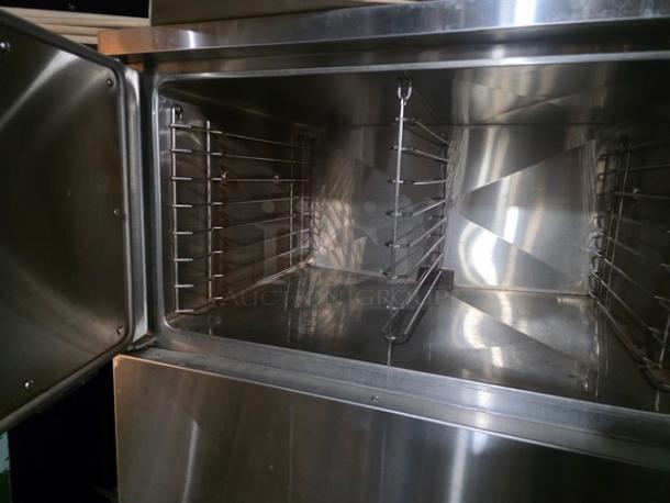 Vulcan-Hart VS3616GE Natural Gas Convection Steamer, stainless steel interior, open door, 300,000 BTU, excellent condition.