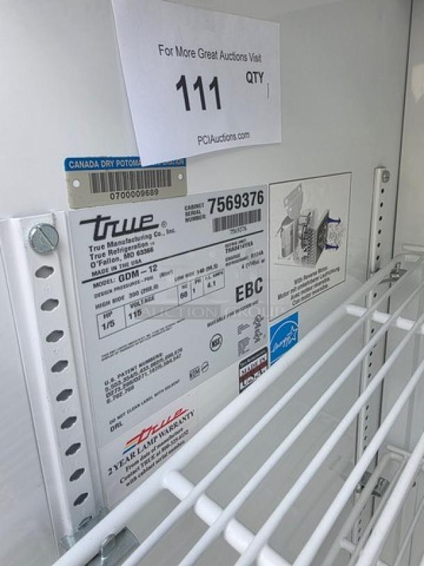 True GDM-12 Single Swing Glass Door Merchandiser, features include model details and warranty info on interior label.