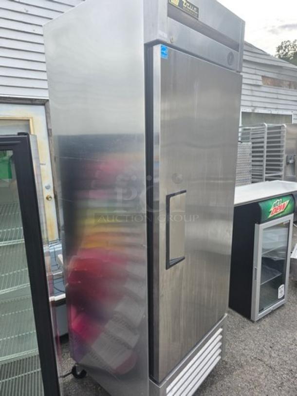 True T-23 Reach-in Refrigerator, solid swing door, on casters. Stainless steel, commercial-grade, excellent condition.