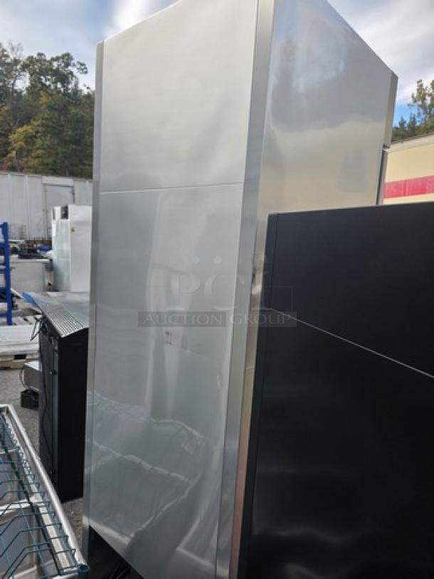 True T-23 reach-in solid swing door refrigerator on casters, stainless steel, used condition, ideal for commercial use.