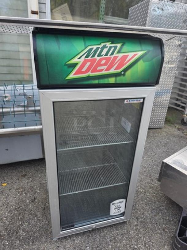 CTB120 Countertop Cooler with glass door, Mountain Dew branding, two shelves, used condition, dimensions 28" x 16" x 20".