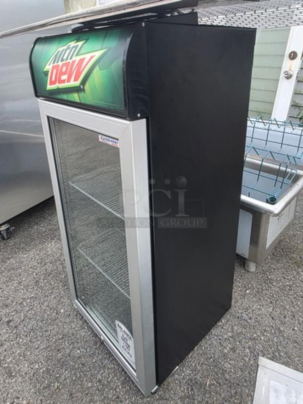 CTB120 Countertop Cooler, Mountain Dew branding, glass door, two shelves, black and silver finish, good condition.