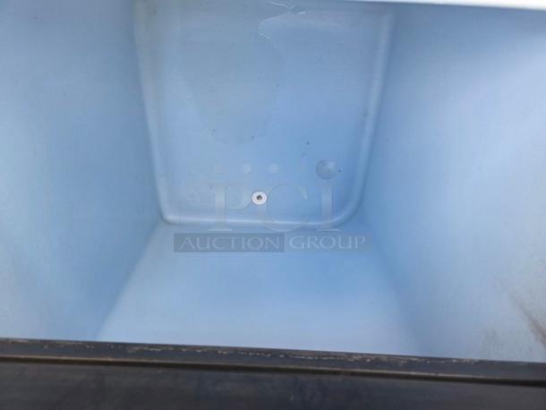 Ice-O-Matic ICE0500HA5 ice machine's interior bin, showcasing clean, spacious compartment for ice storage.