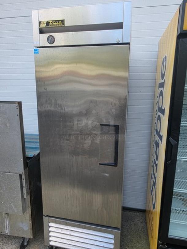 True T-23F reach-in solid swing door freezer on casters, stainless steel, visible True logo, good condition.