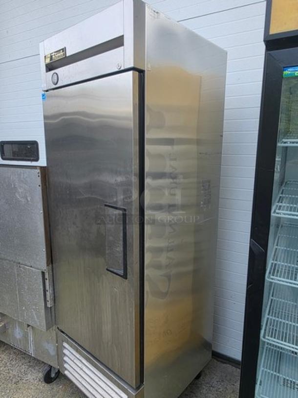 True T-23F reach-in solid swing door freezer on casters, stainless steel finish, in good condition.