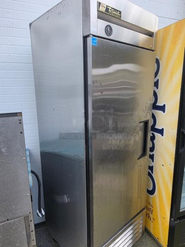 True T-23F reach-in freezer, solid swing door, on casters, stainless steel, visible brand label, used condition.
