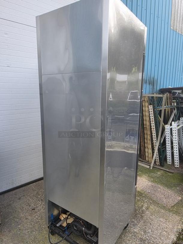 True T-23F Reach-in Solid Swing Door Freezer on casters, stainless steel, used condition, exterior view.