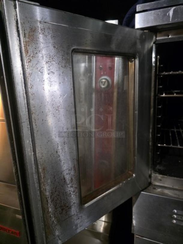 Blodgett SH1G-AA double stack natural gas convection ovens on casters, stainless steel, visible wear, partially open door.