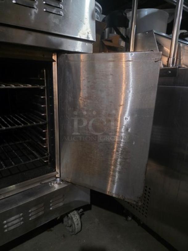 Blodgett SH1G-AA double stack natural gas convection ovens on casters; stainless steel exterior; open door; visible racks inside; used condition.