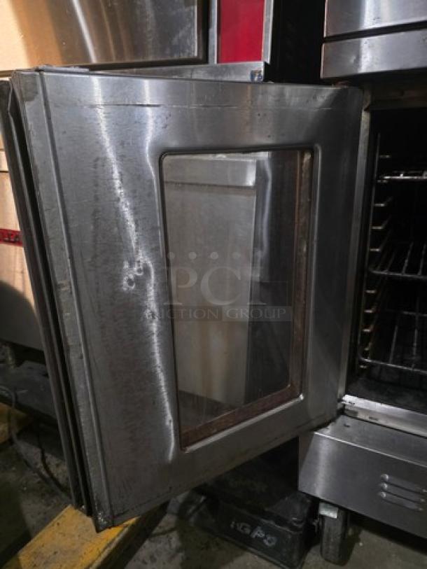 Blodgett SH1G-AA double stack natural gas convection ovens on casters, showing stainless steel exterior and open door.