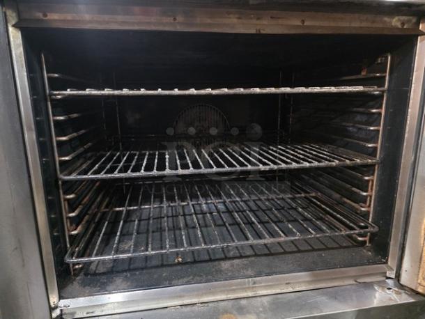 Blodgett SH1G-AA natural gas convection oven interior, double stack, on casters, features sturdy racks, well-maintained.