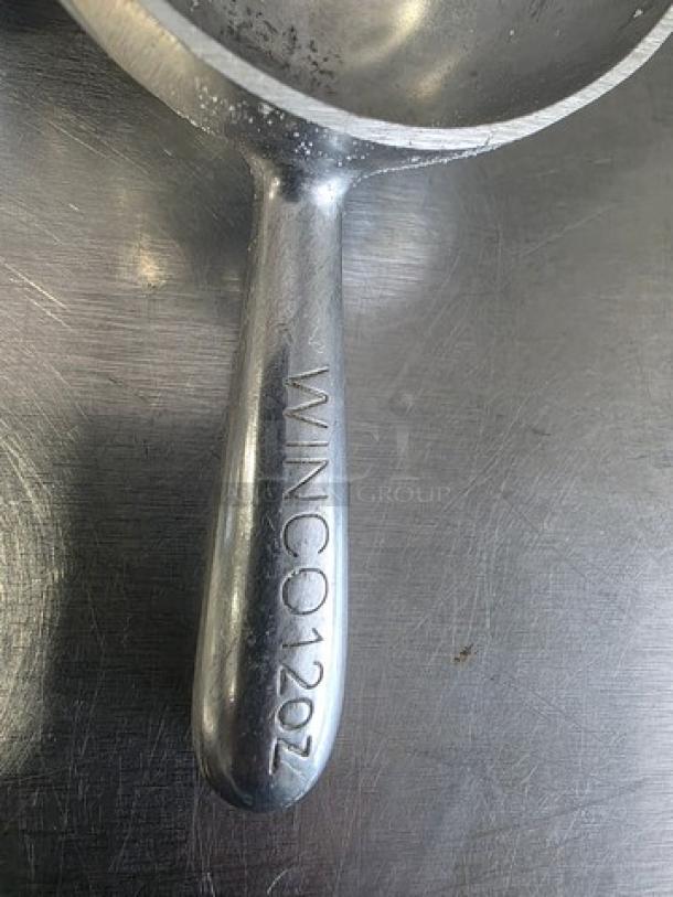 Lot of 2 Winco 12oz stainless steel scoops. "WINCO 12OZ" etched on handle. Durable and in good condition.
