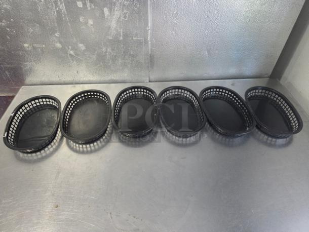 Lot of 6 TableCraft 1076 oval platter baskets, black, good condition; plastic weave design, ideal for serving.
