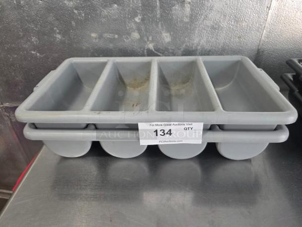 Lot of 2 gray plastic cutlery bins, each with four compartments. Visible wear and auction tag "134, QTY-2".