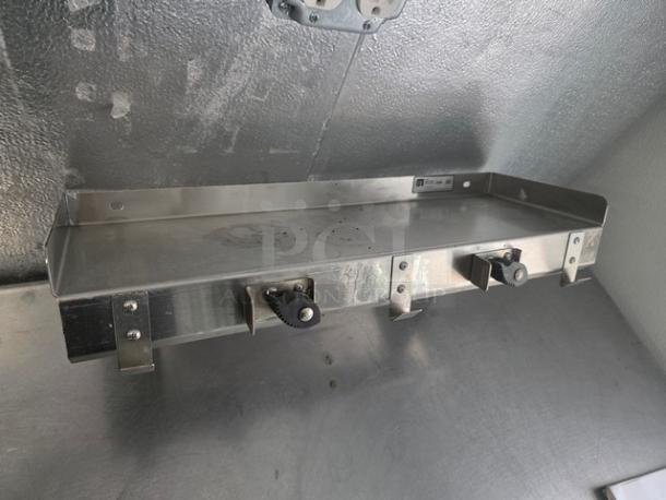 Stainless steel wall shelf by John Boos, in excellent condition, featuring sturdy brackets and a smooth finish.