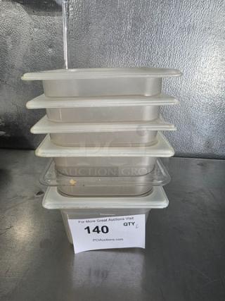 Lot of 6 square plastic food pans, stacked. Used condition. Auction tag reads "140 QTY 6."
